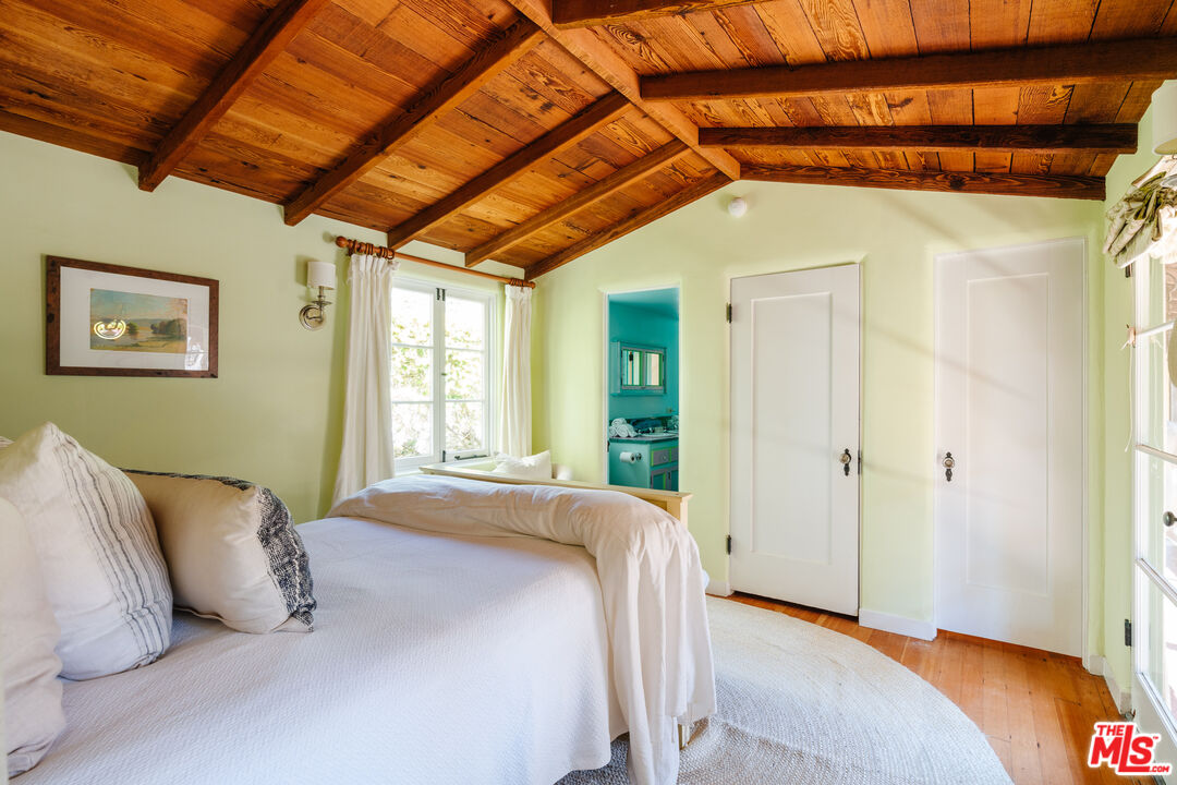 35145 Beach Road Dana Point, CA 92624 - Photo 31 of 57 a bedroom with a bed and a window