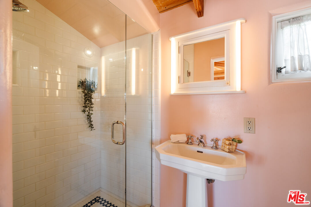 35145 Beach Road Dana Point, CA 92624 - Photo 40 of 57 a bathroom with a sink a toilet and shower
