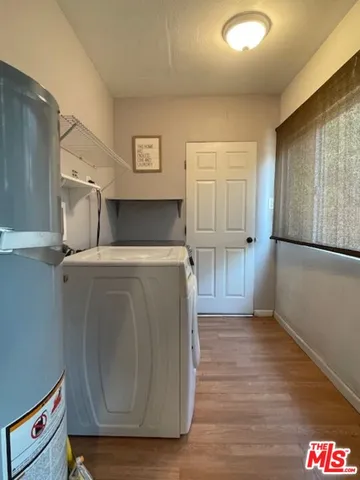 a bedroom with a bed and a mirror