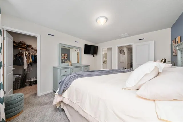 a spacious bathroom with a double vanity sink and a mirror
