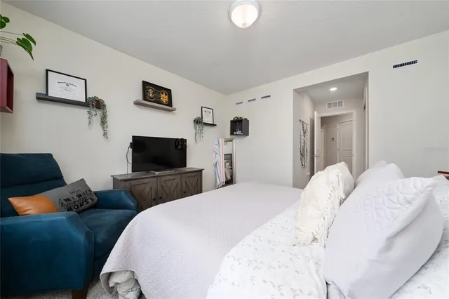 a bathroom with a double vanity sink toilet and shower