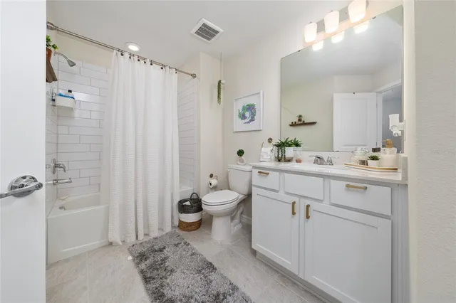 a view of a porch with furniture and garden