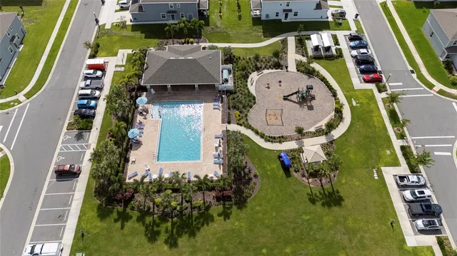 a kitchen with refrigerator and cabinets