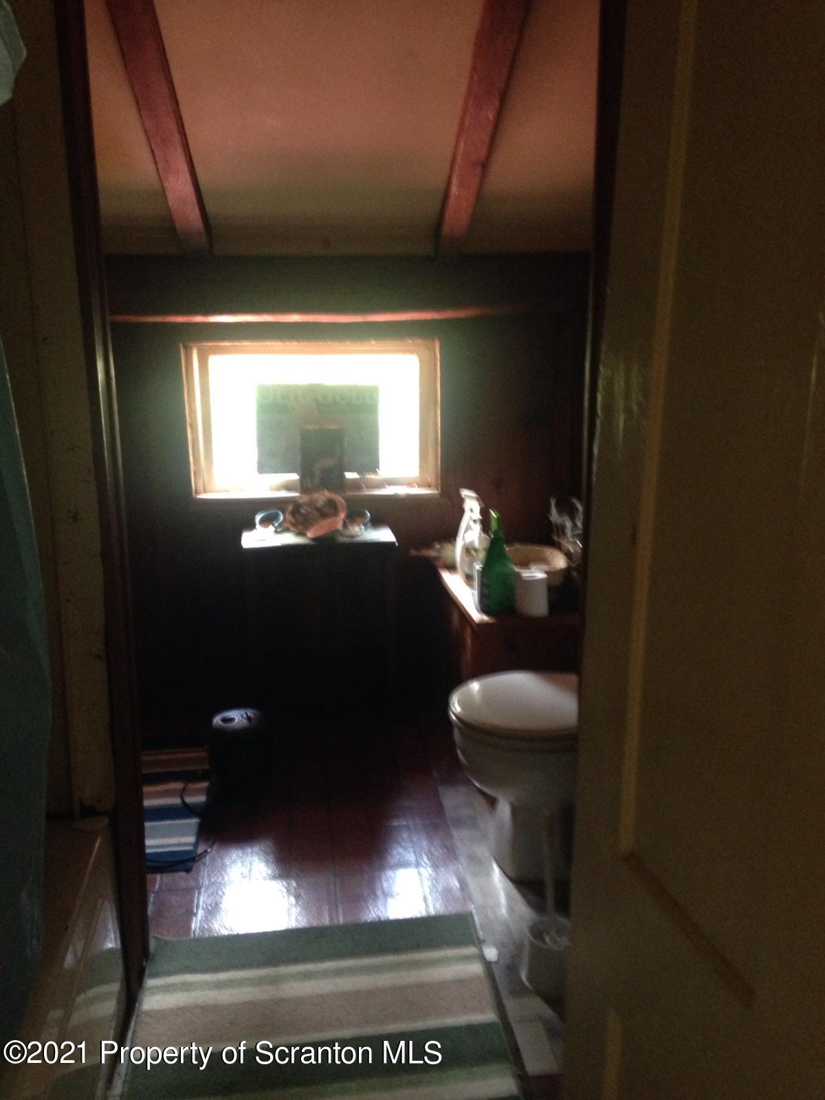 1707 Blaisure Road Montrose, PA 18801 - Photo 17 of 20 a bathroom with a sink and a mirror