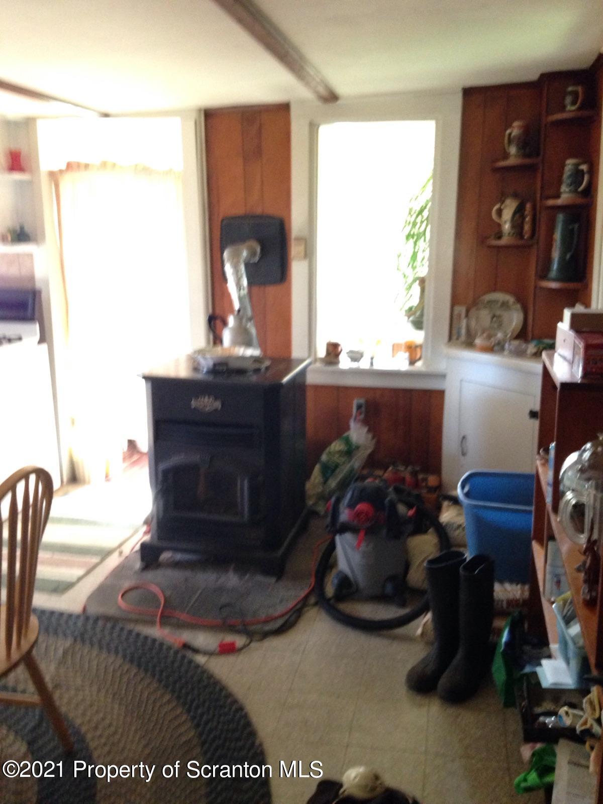 1707 Blaisure Road Montrose, PA 18801 - Photo 6 of 20 a living room with furniture and a window