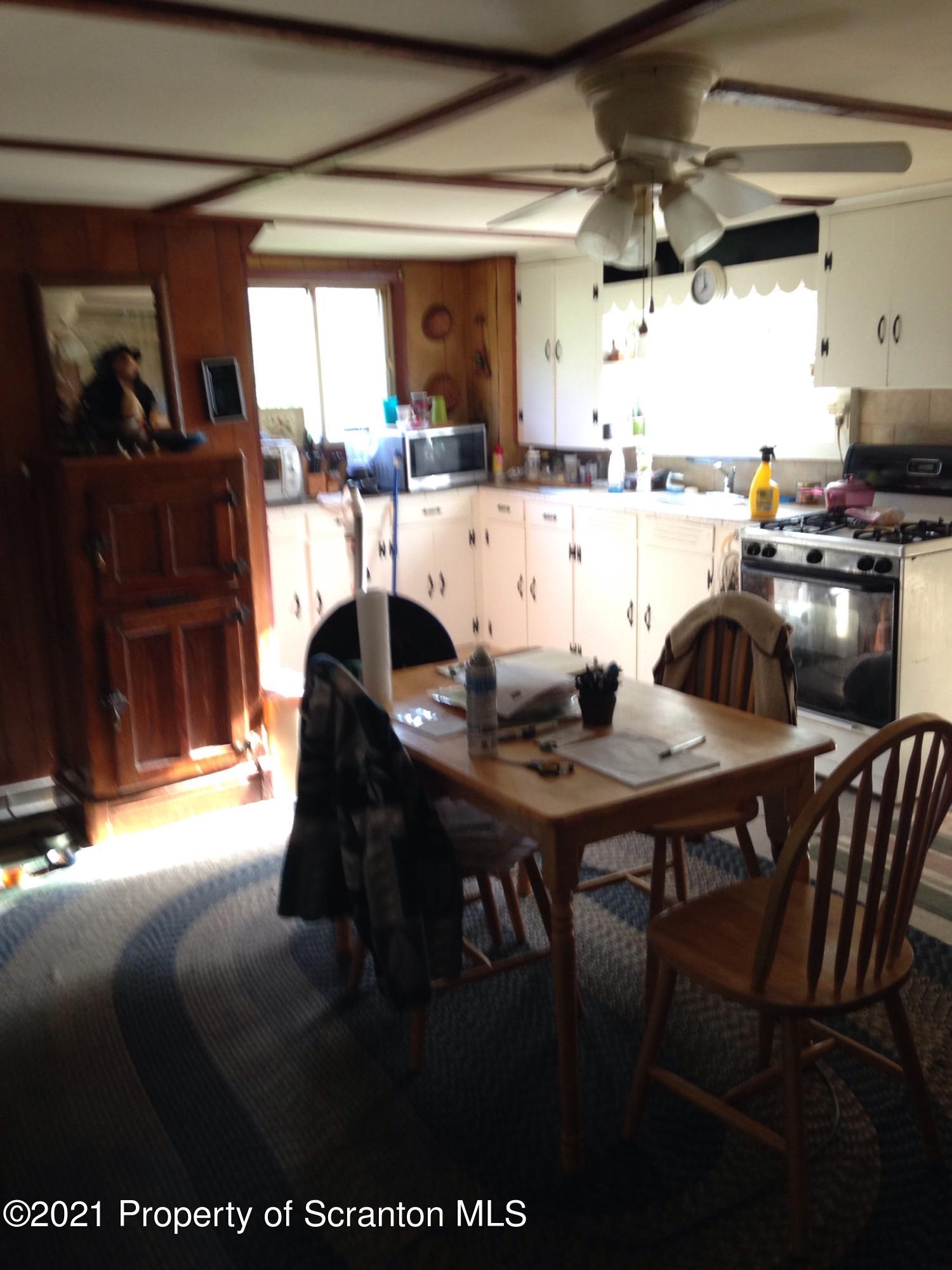 1707 Blaisure Road Montrose, PA 18801 - Photo 7 of 20 a view of a dining room with furniture and chandelier