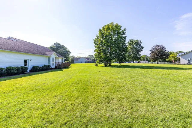 a view of a swimming pool with an outdoor space and seating area