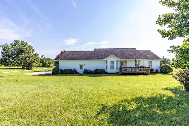 a front view of house with yard and seating area