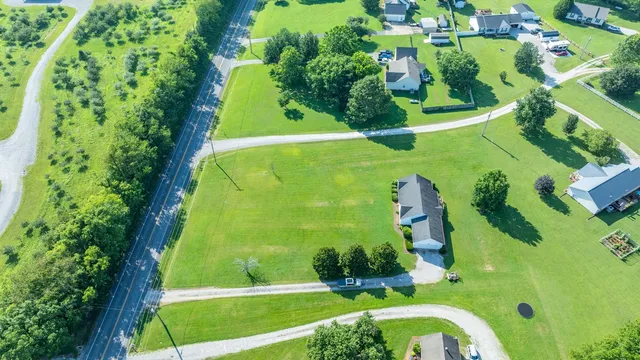 a view of a swimming pool with a yard