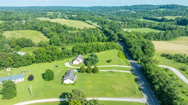 a view of a swimming pool with a yard
