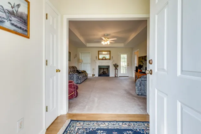 a view of living room with furniture and fireplace
