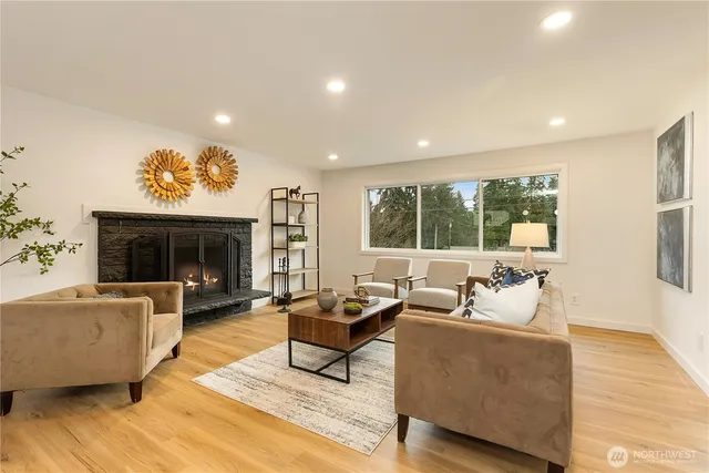 a living room with furniture and a fireplace