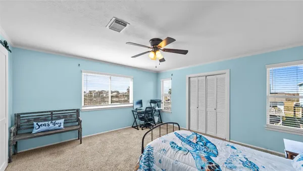 a bedroom with bed and a window