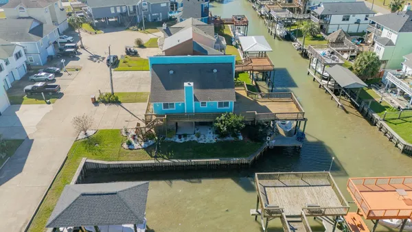 an aerial view of residential houses with outdoor space