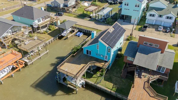 an aerial view of a house with a ocean view
