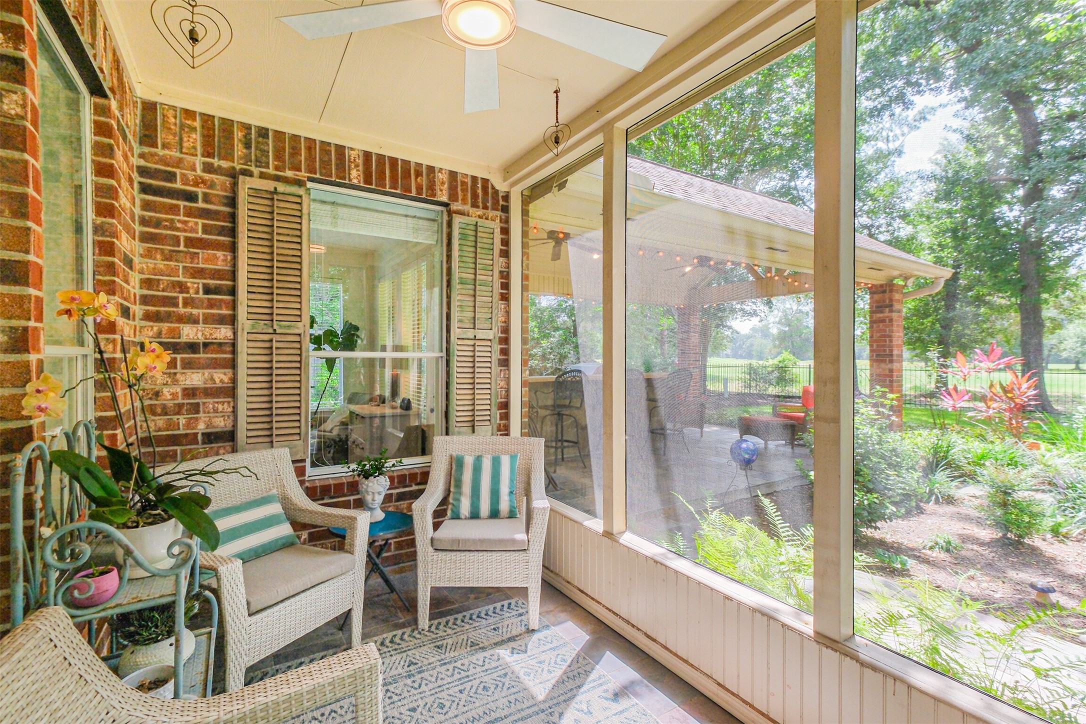14919 Codys Run Cypress, TX 77429 - Photo 10 of 32 Enjoy the outdoors in comfort from the spacious screened porch. Whether you're sipping your morning coffee, reading a book, or gathering with friends, this inviting space lets you take in the peaceful backyard and golf course views while staying protected from the elements.