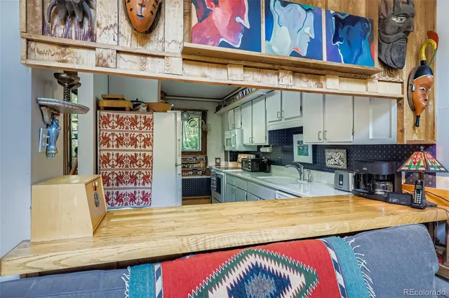 a view of a swimming pool with outdoor seating