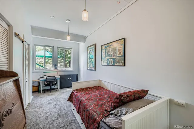 a bedroom with a bed and furniture