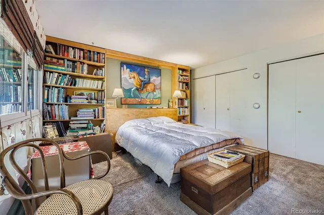 a bedroom with bed and furniture