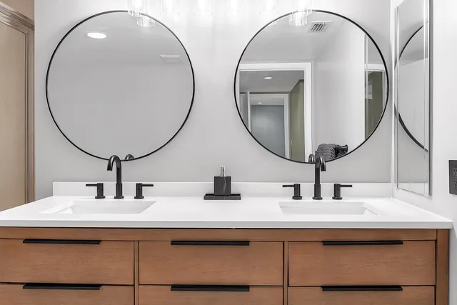 a bathroom with a sink and a mirror
