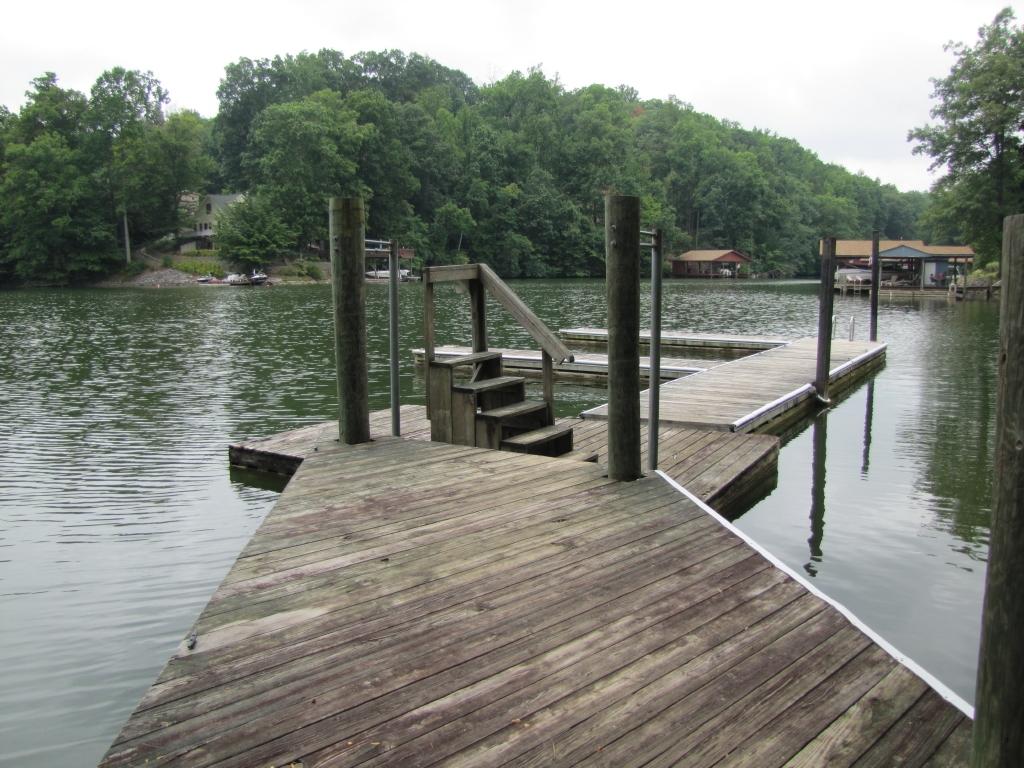 110 Old Post Road Moneta, VA 24121 - Photo 2 of 99 a view of a lake with a wooden deck