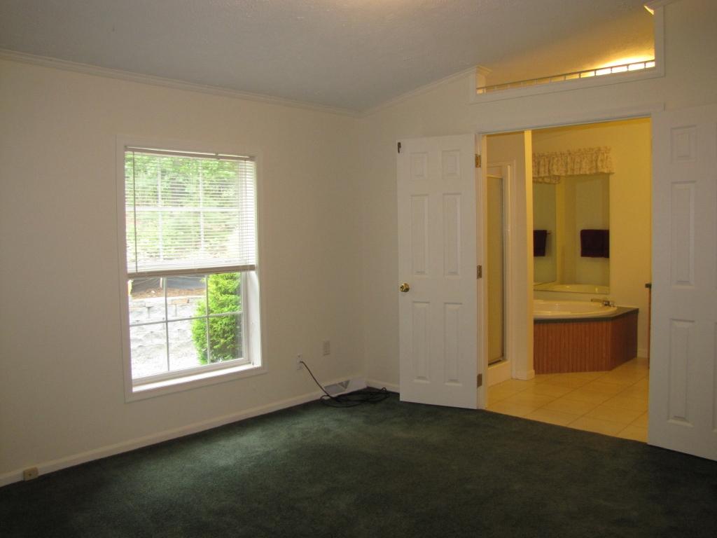 110 Old Post Road Moneta, VA 24121 - Photo 12 of 99 a view of an empty room with a window