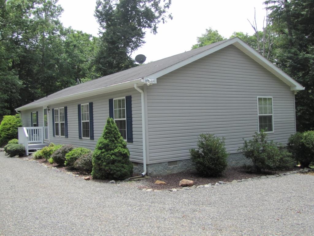 110 Old Post Road Moneta, VA 24121 - Photo 20 of 99 a view of a house with a yard and plants
