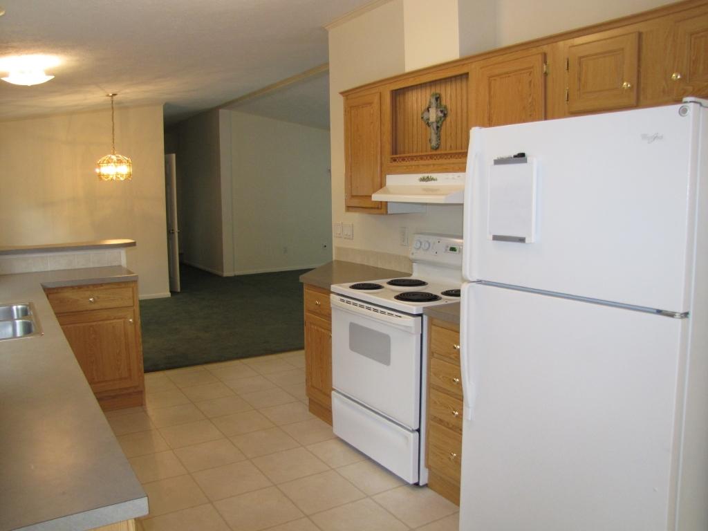 110 Old Post Road Moneta, VA 24121 - Photo 24 of 99 a white refrigerator freezer and a stove sitting inside of a kitchen