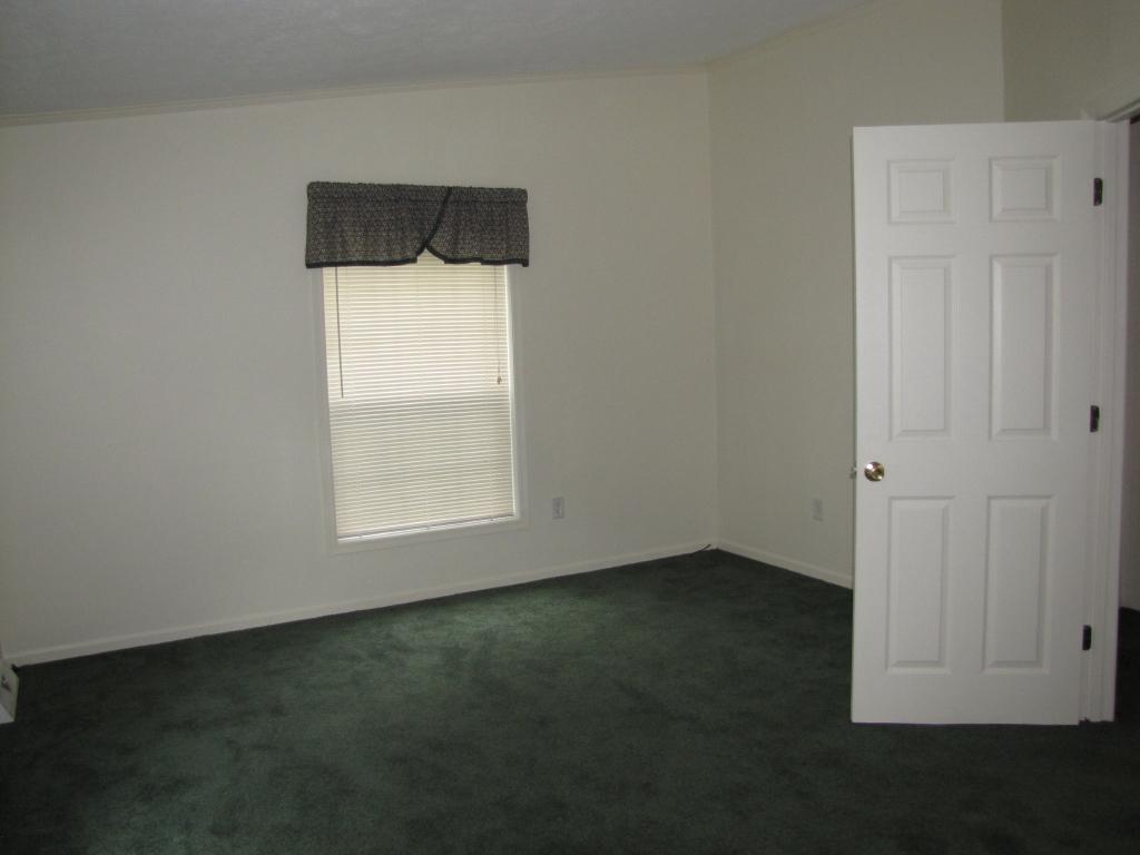 110 Old Post Road Moneta, VA 24121 - Photo 33 of 99 an empty room with wooden floor and windows