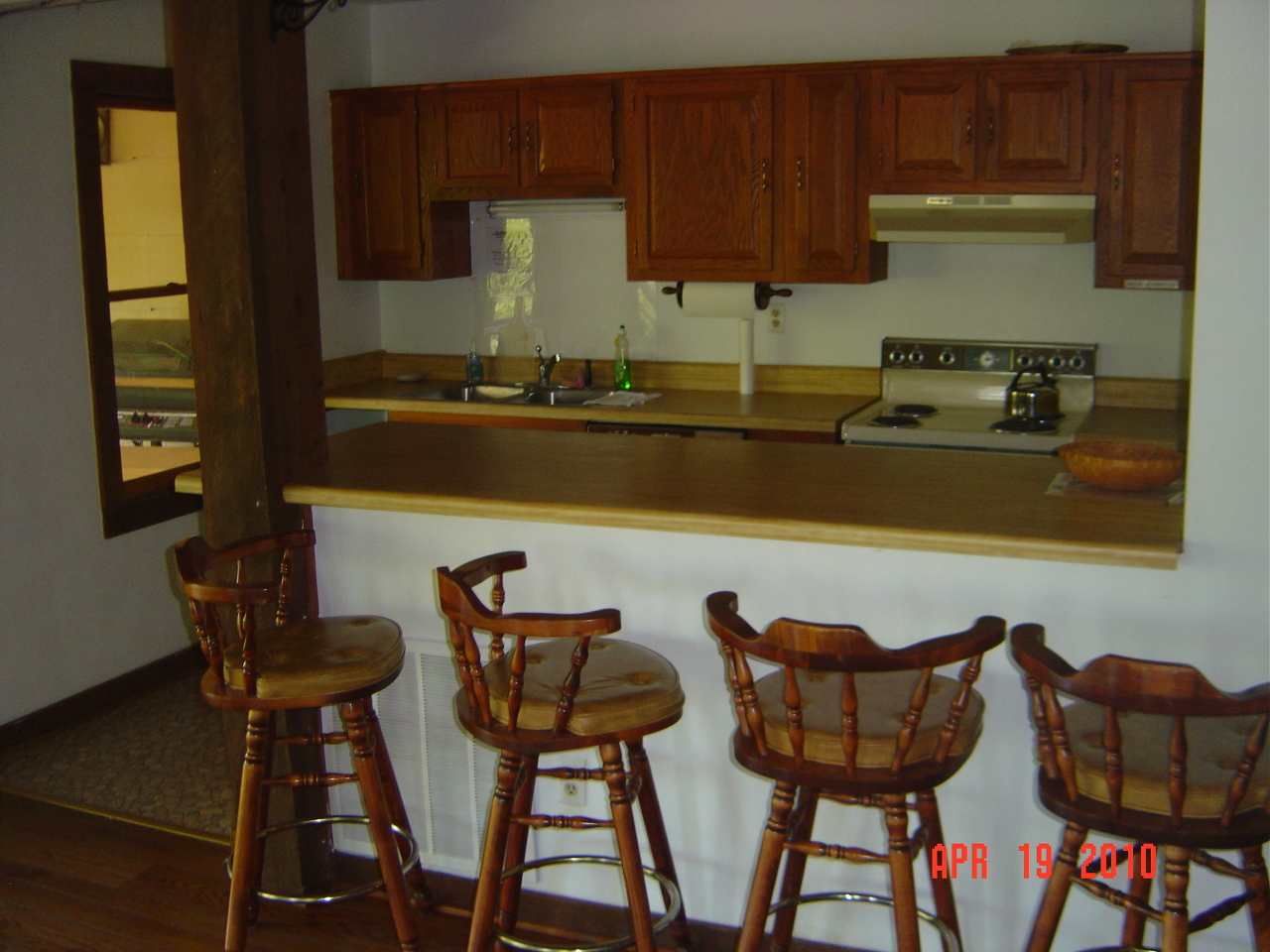 110 Old Post Road Moneta, VA 24121 - Photo 93 of 99 a table and chairs in a kitchen with granite countertop wooden cabinets