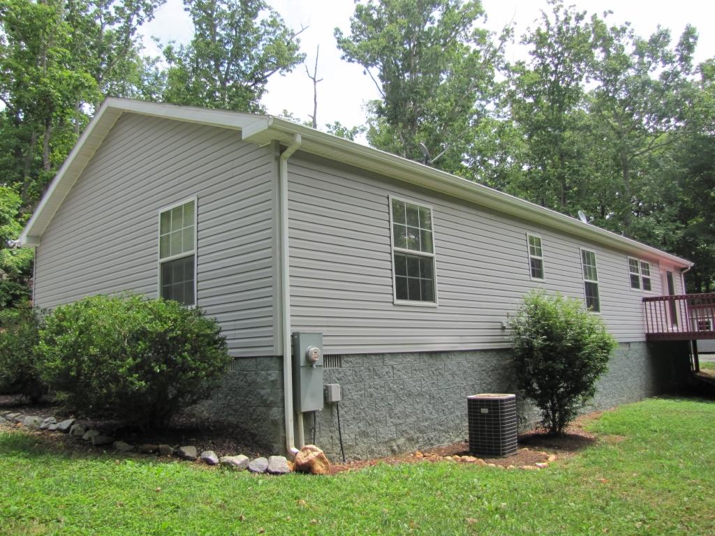 110 Old Post Road Moneta, VA 24121 - Photo 99 of 99 a front view of house with a garden