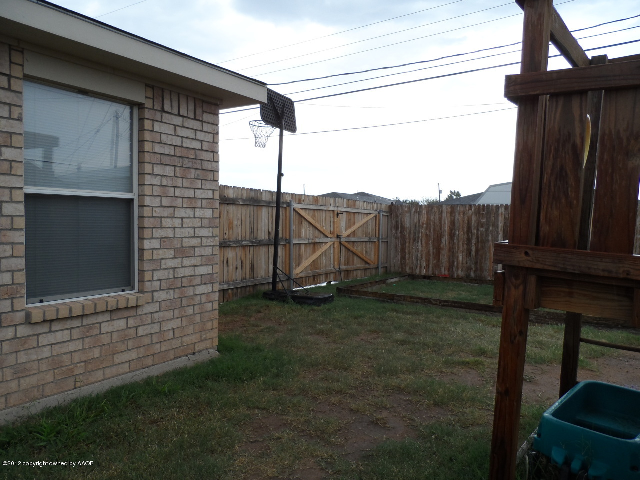 1173 Rushmore Drive Amarillo, TX 79110 - Photo 22 of 26 a backyard of a house with barbeque oven
