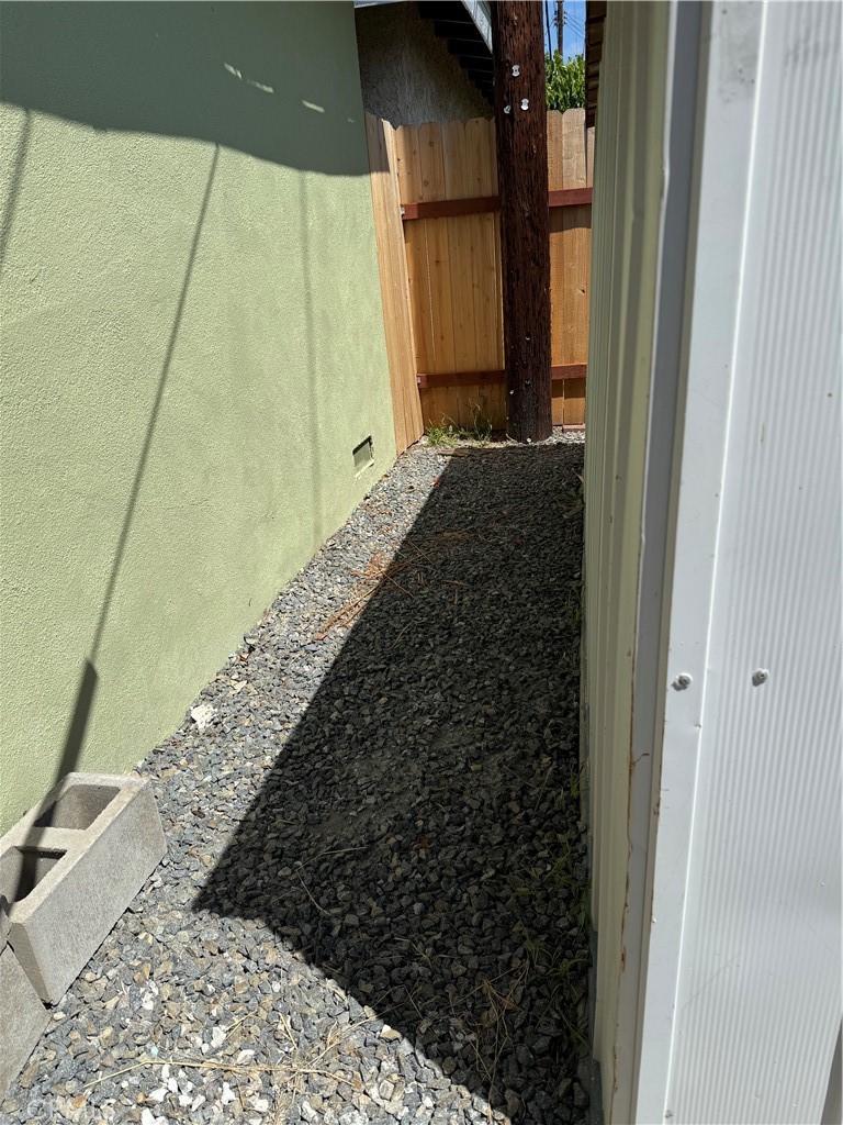 110 Rigsby Street La Habra, CA 90631 - Photo 40 of 41 Between garage and small shed gravel and new fence.