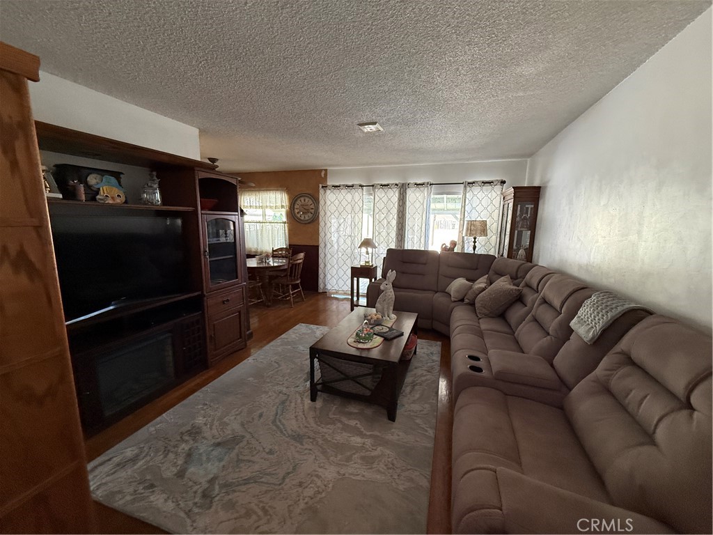 110 Rigsby Street La Habra, CA 90631 - Photo 8 of 41 Comfy Living room with sliding door access to backyard