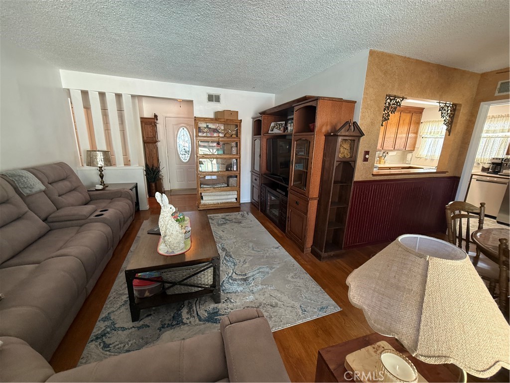 110 Rigsby Street La Habra, CA 90631 - Photo 9 of 41 view from Sliding door, dining room to right with sight into kitchen and front door.