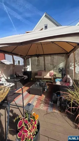 a view of a patio with table and chairs