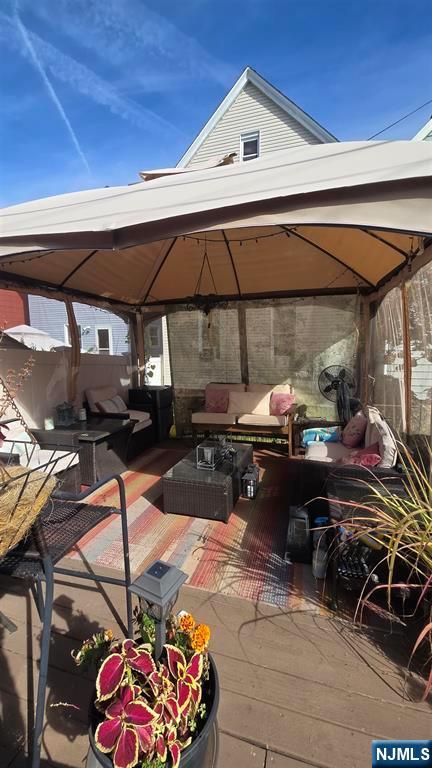 157 West 4th Street Bayonne, NJ 07002 - Photo 2 of 3 a view of a patio with table and chairs