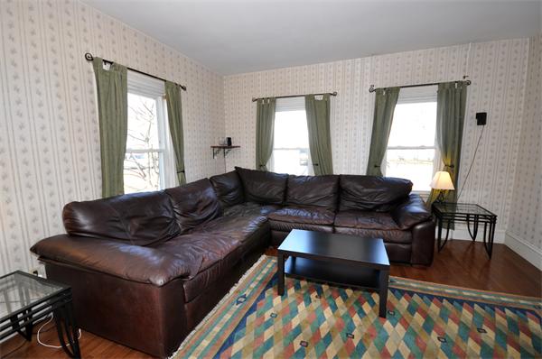 62 Central Street Framingham, MA 01701 - Photo 11 of 23 a living room with furniture and a window