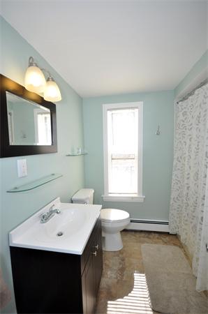 62 Central Street Framingham, MA 01701 - Photo 12 of 23 a bathroom with a sink a toilet and mirror
