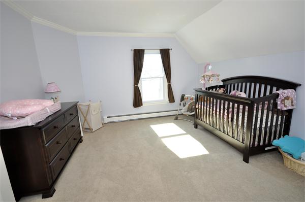 62 Central Street Framingham, MA 01701 - Photo 17 of 23 a view of a room with a baby crib