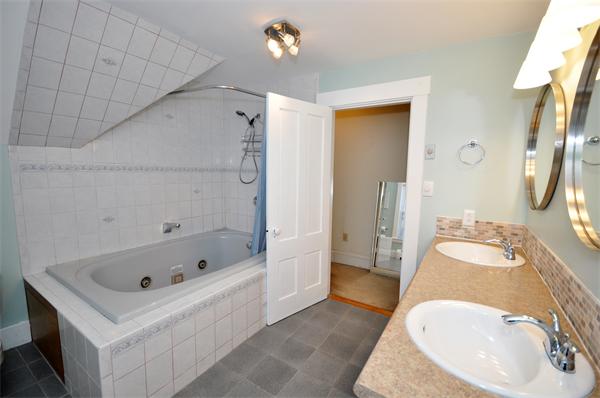 62 Central Street Framingham, MA 01701 - Photo 19 of 23 a bathroom with a sink a toilet and shower