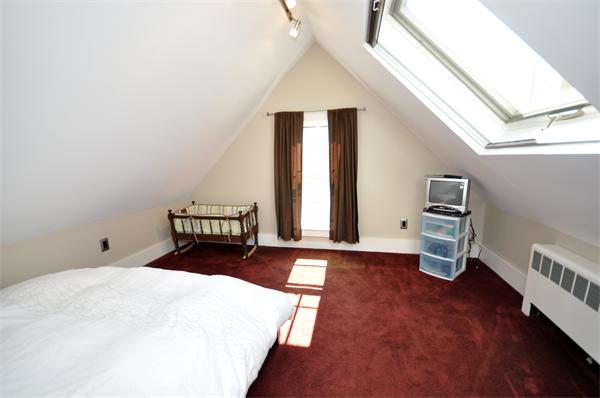 62 Central Street Framingham, MA 01701 - Photo 20 of 23 a bedroom with a bed and a window