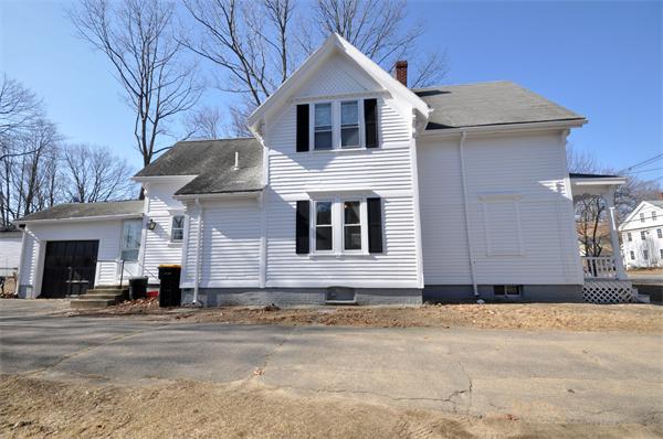 62 Central Street Framingham, MA 01701 - Photo 3 of 23 a front view of a house with a yard