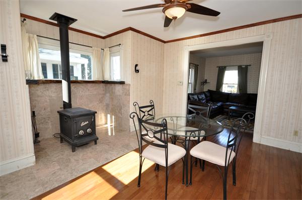62 Central Street Framingham, MA 01701 - Photo 7 of 23 a living room with furniture and a chandelier