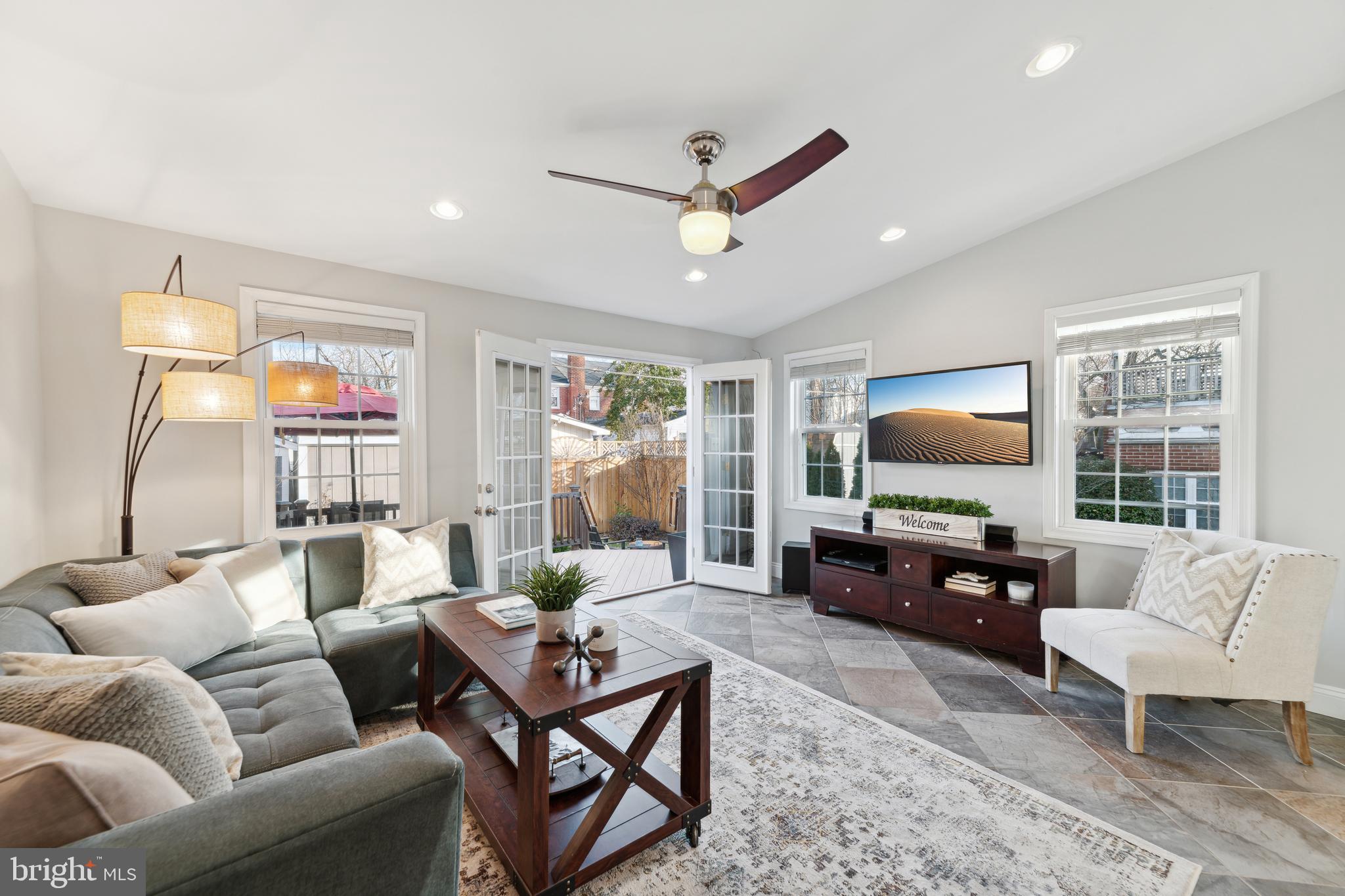 5921 Monticello Road Alexandria, VA 22303 - Photo 14 of 40 Recessed lights, ceiling fan and large windows