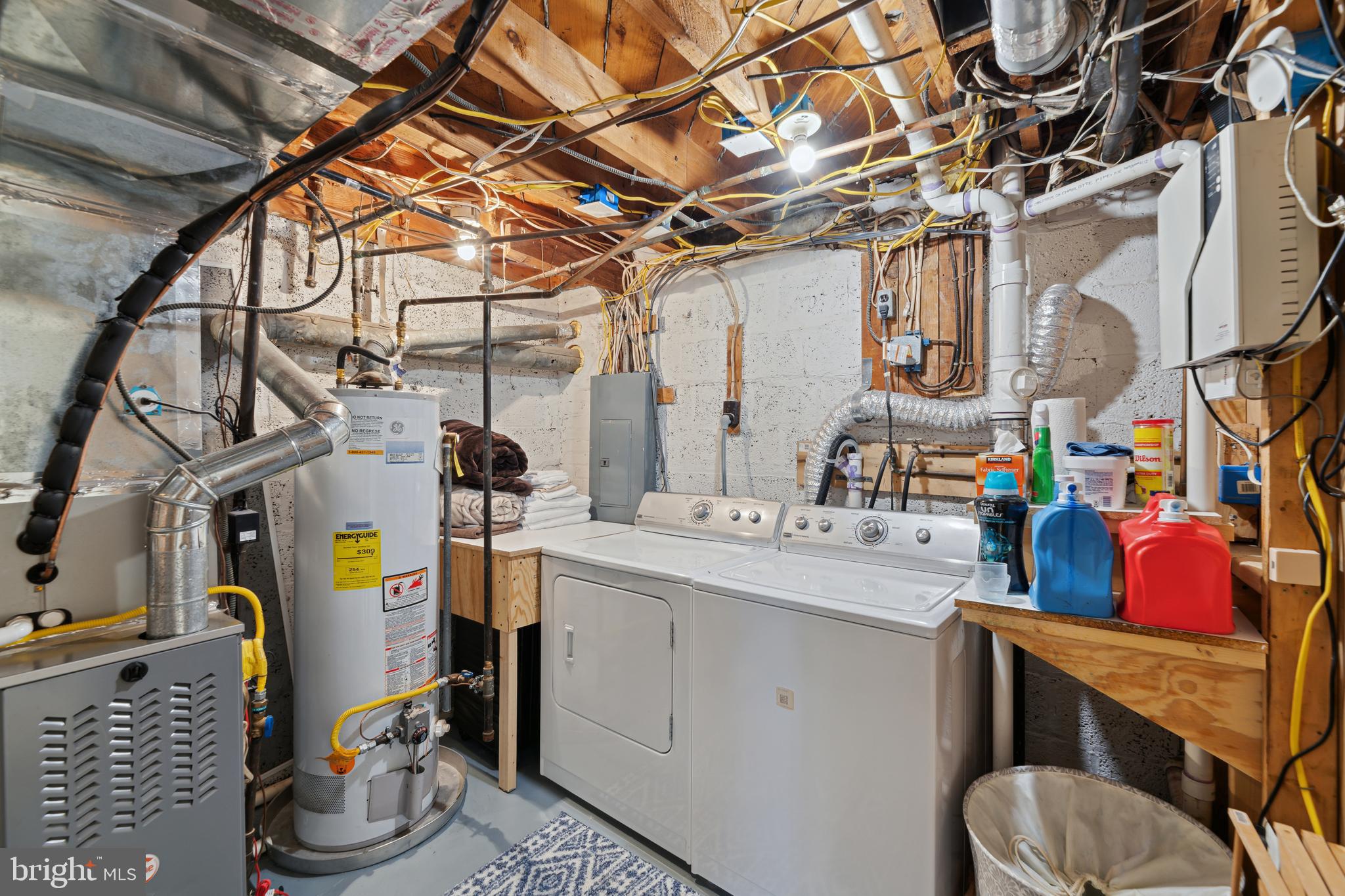 5921 Monticello Road Alexandria, VA 22303 - Photo 33 of 40 Lower level laundry with built-in storage shelves