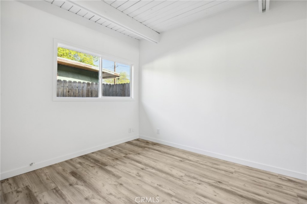 528 Creston Road Paso Robles, CA 93446 - Photo 13 of 46 a view of an empty room with wooden floor and a window