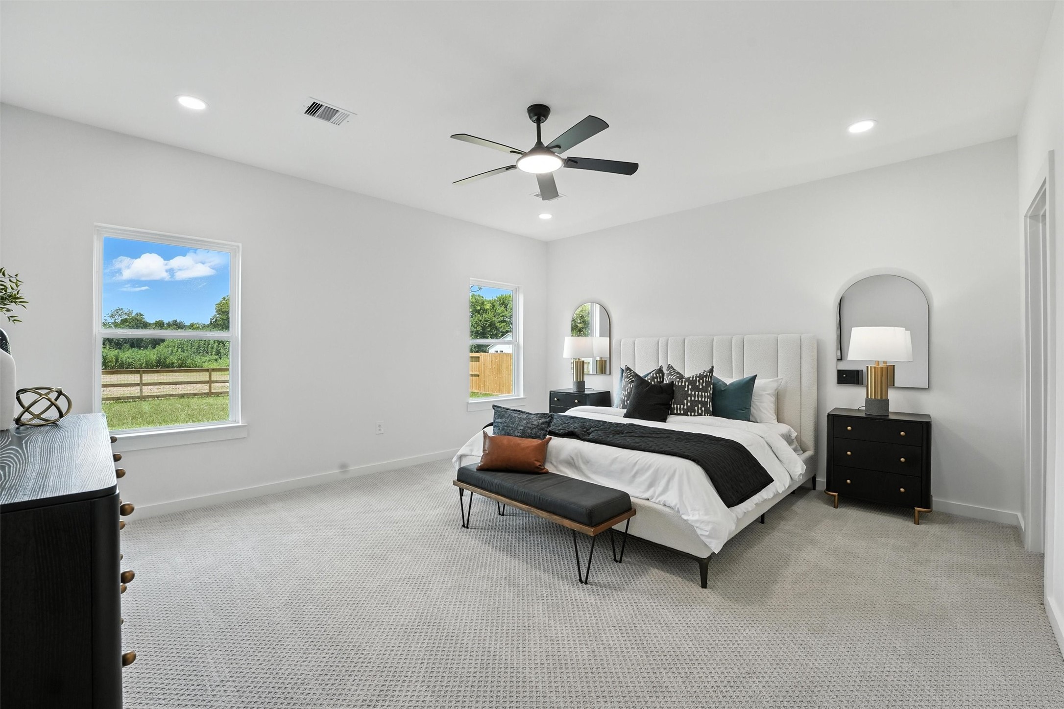 256 Davis Bend Road Alvin, TX 77511 - Photo 14 of 34 a bed room with a bed and a chandelier