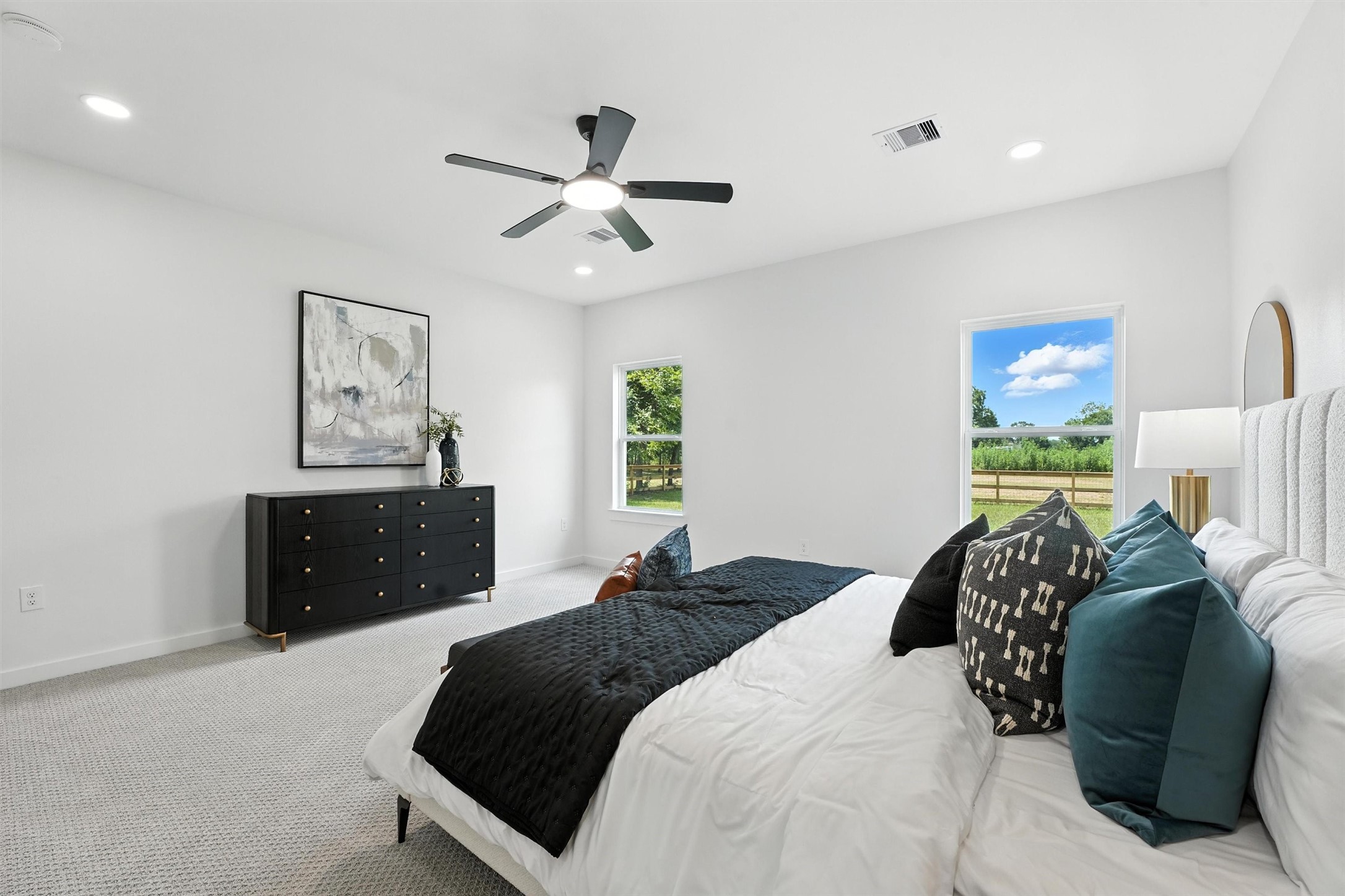 256 Davis Bend Road Alvin, TX 77511 - Photo 16 of 34 a bedroom with a bed and window