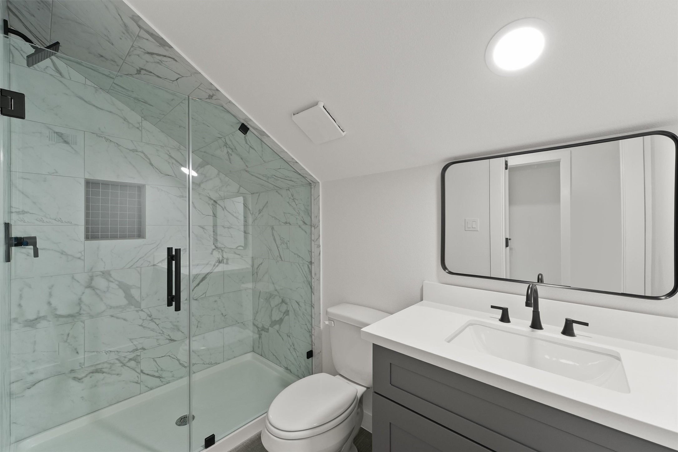 256 Davis Bend Road Alvin, TX 77511 - Photo 26 of 34 a bathroom with a sink a toilet and shower